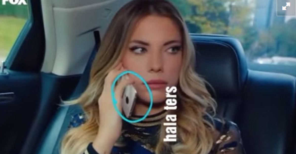 Yıldız telefonunu ters tutuyor 