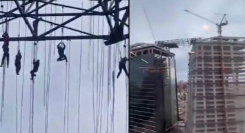 İnşaat iskelesi bir anda çöktü: 150 metre yüksekte asılı kaldılar