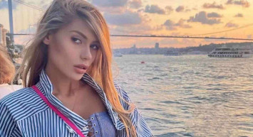 Nihal Candan çok konuşulan sosyal medya paylaşımlarına hız kesmeden devam ediyor! Göğüs dekolteli derin yırtmaçlı elbisesiyle boğaza karşı poz verdi