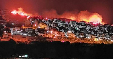 İzmir'de Yerleşim Alanlarına Yaklaşan Makilik Yangınına Müdahale Ediliyor