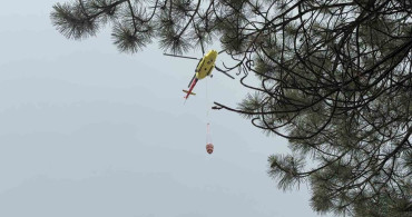 Kütahya'da ormanlık alanda çıkan yangın helikopter desteği ile söndürüldü