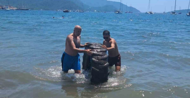 Marmaris halk plajında dev traktör lastiği denizden çıkarıldı