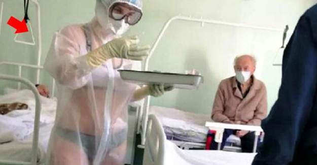 Rusya'da Bikini ve Koruyucu Elbise Giyen Hemşire Uyarıldı