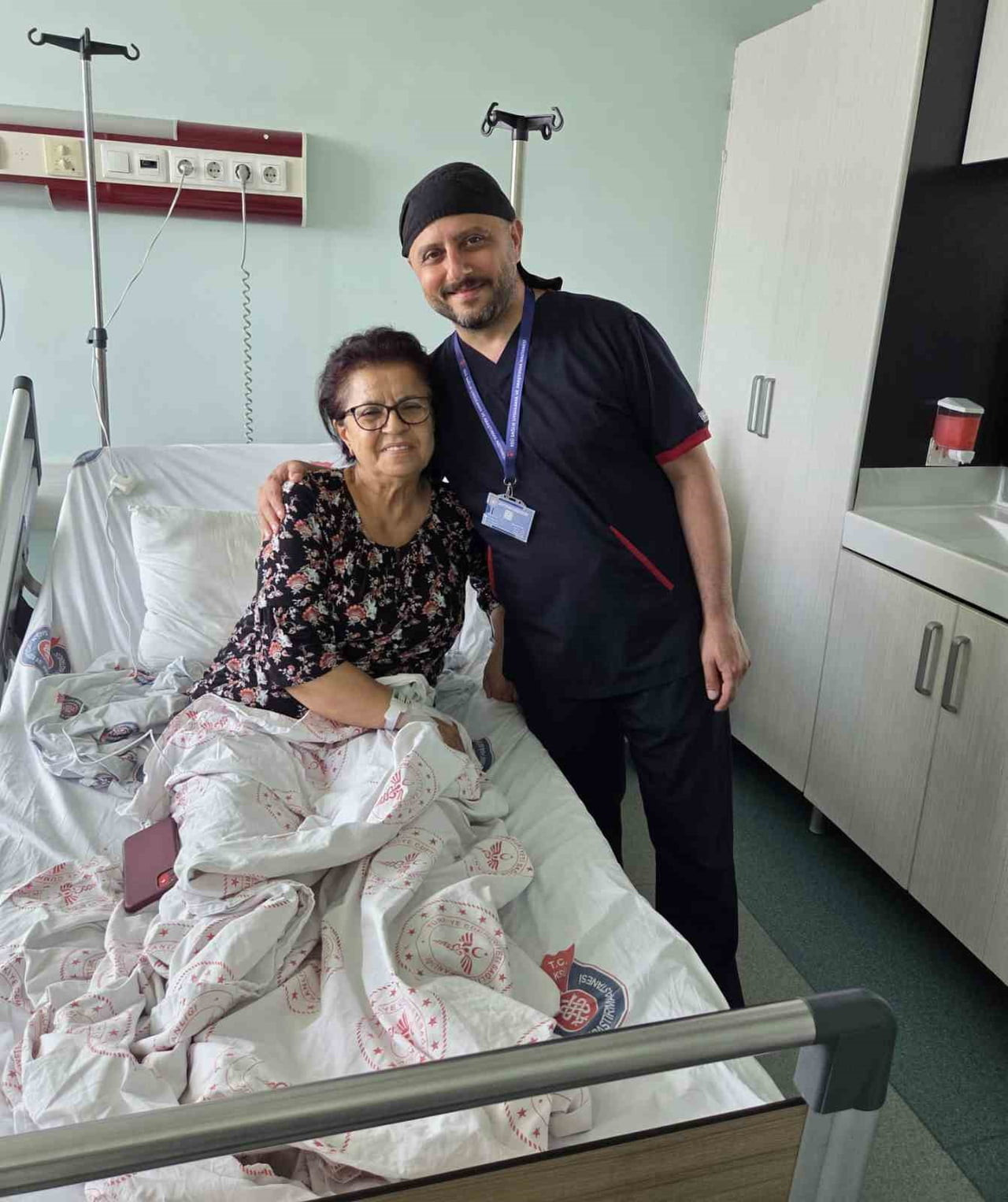 EMEKLİ ÖĞRETMEN HALİDE AKBEN VE PROF. DR. MEHMET KİRİŞÇİ.