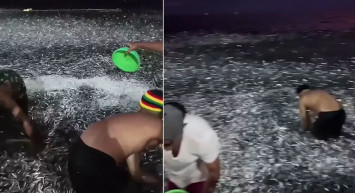 Filipinler'de hayrete düşüren anlar! Milyonlarca balık kıyıya vurdu: Kova kova topladılar! Kıyamet alameti...